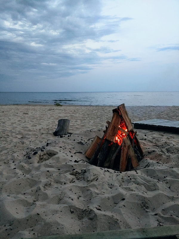 Campfire on beach of Lake Michigan. 